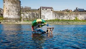 High tea at low tide in Limerick as man cools off with a cuppa on the river