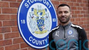 Phil Bardsley signs for Stockport and donates his wages to charity