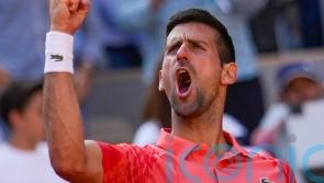 Novak Djokovic fights back to book place in French Open semi-finals