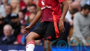 Manchester United defender Leny Yoro seen on crutches with left foot injury