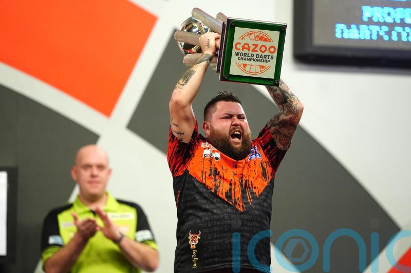Michael Smith throws nine-darter en route to winning maiden World Championship