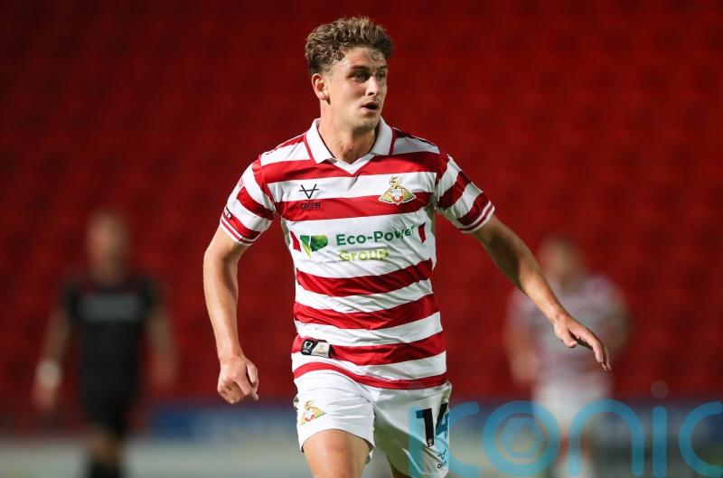Harrison Biggins and George Miller fire Doncaster to victory over AFC Wimbledon