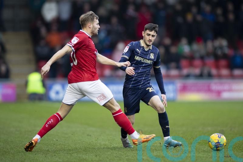 Crewe clinch play-off place as Colchester secure survival