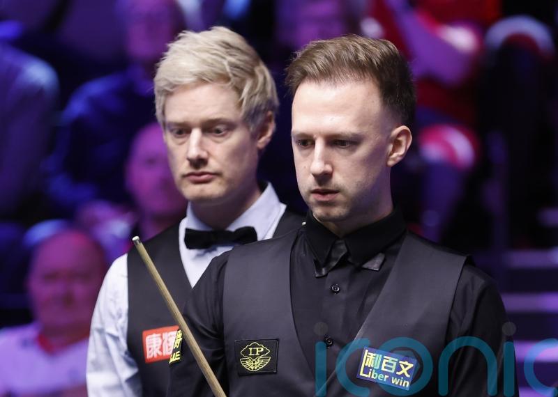 Judd Trump critical of table conditions after reaching last 16 in York