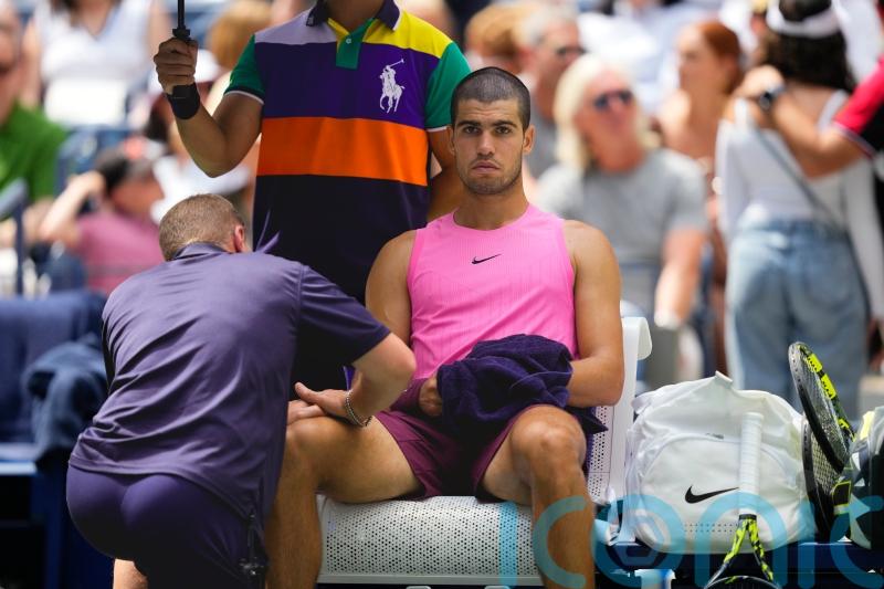 Carlos Alcaraz plays down concerns over knee issue after easing to victory